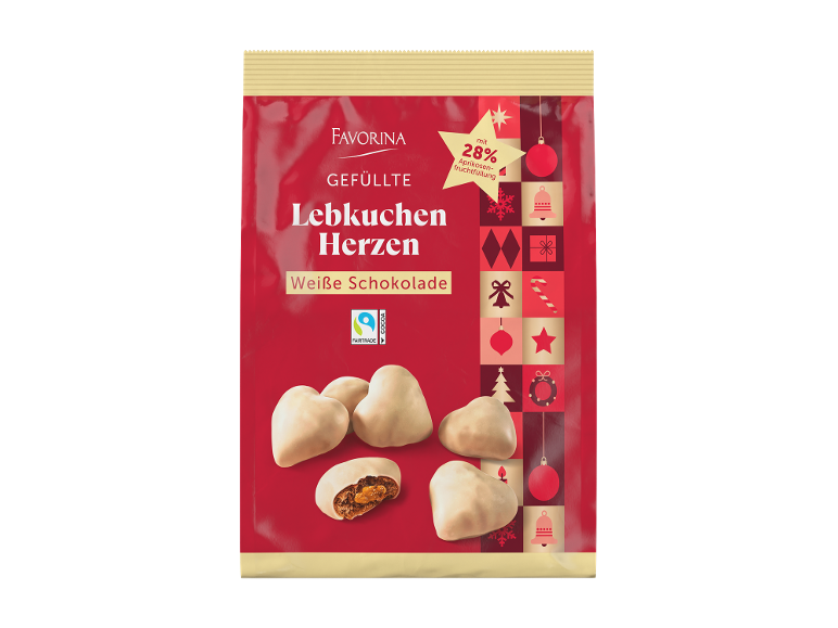 Corações de pão de mel com chocolate branco e recheio de damasco, em embalagem vermelha festiva.