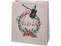 Saco de presente de Natal com uma coroa festiva, poinsétias e o texto 'ho ho ho'.