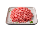 Carne picada crua num prato cinzento com especiarias e salsa.