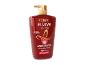 Frasco de shampoo vermelho com bomba dourada para proteção da cor.