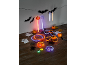 Bastonetes luminosos, pulseiras, anéis e óculos de Halloween com designs de abóboras e fantasmas.
