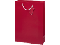 Saco de presente vermelho com uma etiqueta em branco e alças brancas.
