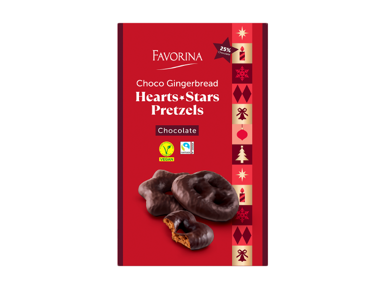 Pão de mel de chocolate em forma de corações, estrelas e pretzels, com os dizeres „VEGAN” e „FAIRTRADE”.