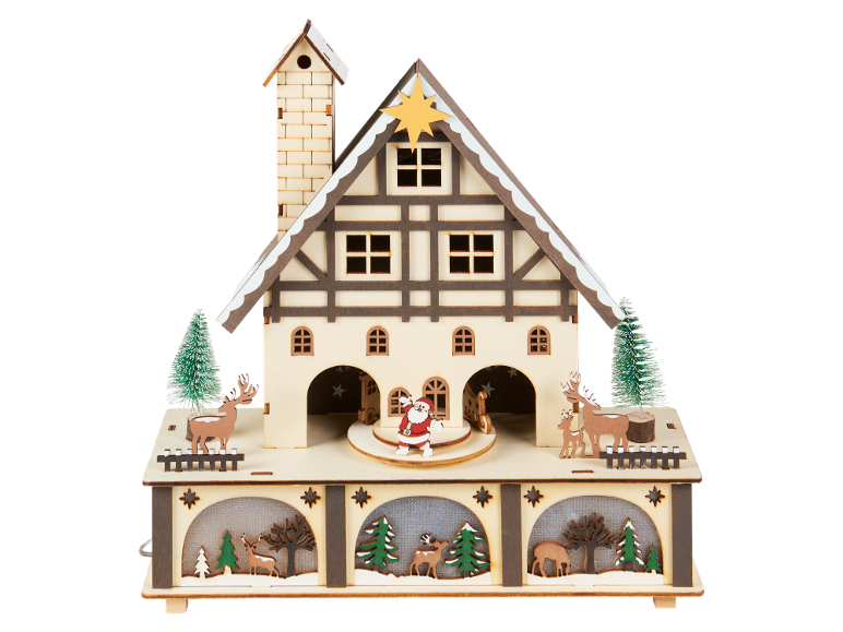 Casa de Natal de madeira com veados e Pai Natal, decorada com uma paisagem de inverno.