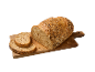 Pão integral com sementes e fatias cortadas numa tábua de cortar de madeira.