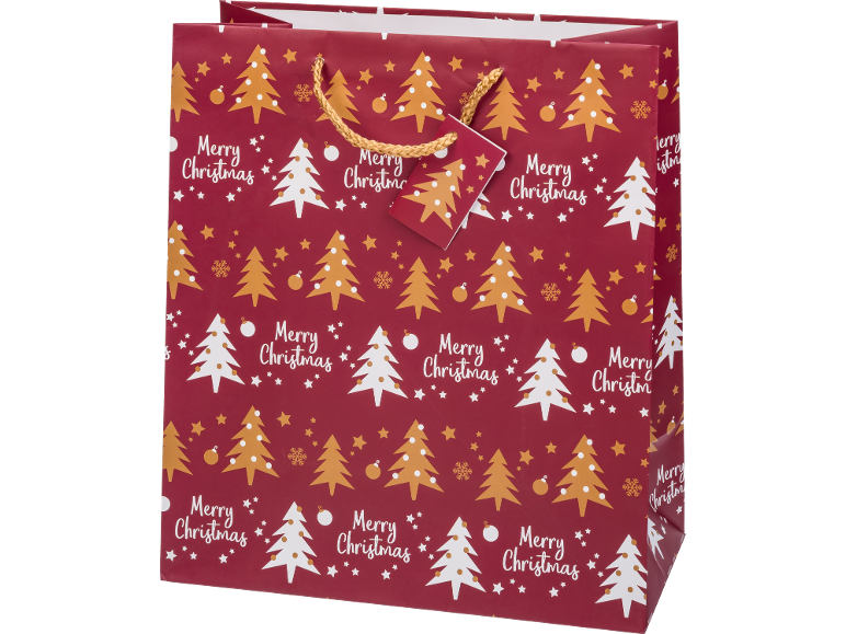 Saco de presente de Natal vermelho com árvores douradas e brancas e texto 'Merry Christmas'.