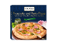 Embalagem de pizza de presunto e pesto, com a inscrição „Wood-Fired Pizza”.