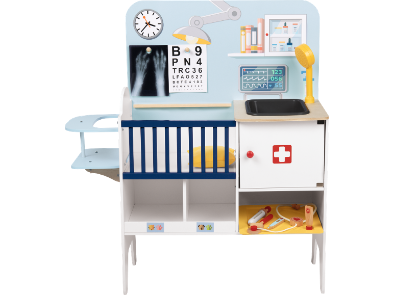 Clínica veterinária de brinquedo com raio-X, tabela de visão, monitor, pia e ferramentas médicas.
