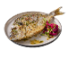 Peixe assado com ervas e couve roxa num prato.