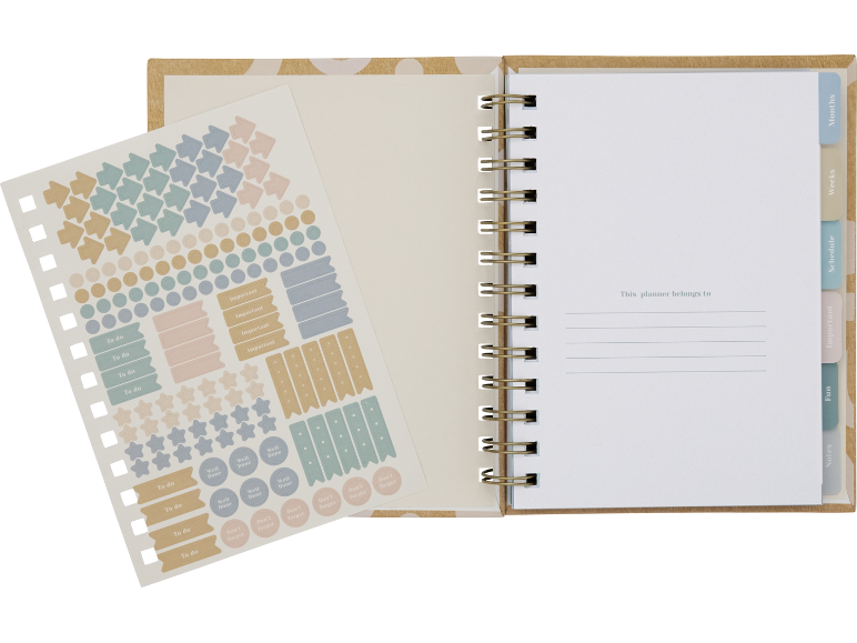 Agenda em espiral com autocolantes coloridos para planeamento e lembretes.