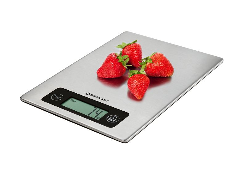 Balança de cozinha digital com morangos, exibindo '74 g'.