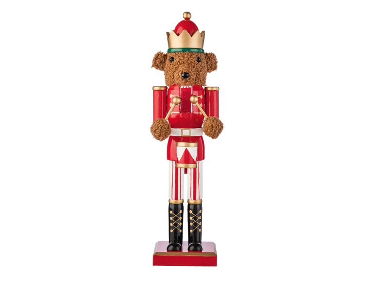 Quebra-nozes de madeira em forma de ursinho de pelúcia, vestido de soldado vermelho com tambor.