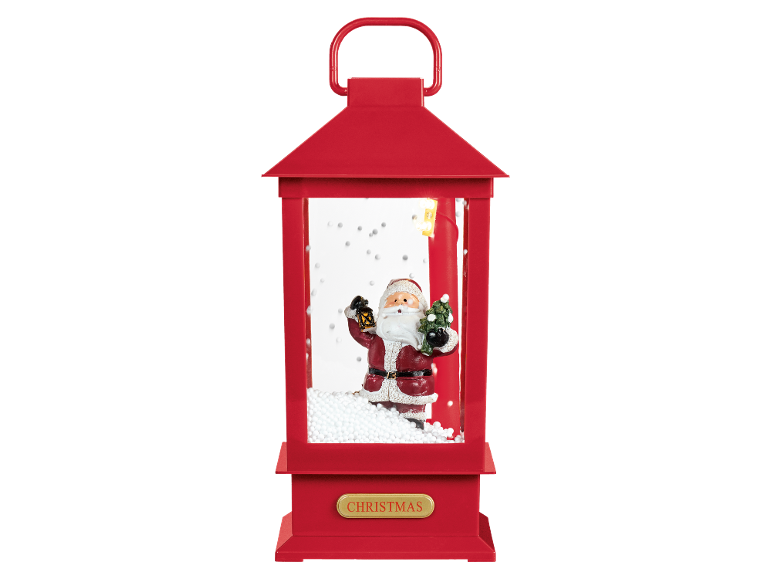 Lanterna de Natal vermelha com um Pai Natal a segurar uma lanterna e uma árvore, com a palavra «CHRISTMAS».