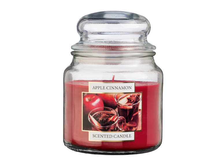 Vela perfumada de maçã e canela num frasco de vidro com tampa.
