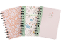 Três cadernos de argolas com padrões florais, um com 'NOTEBOOK' e outro com 'NOTES'.