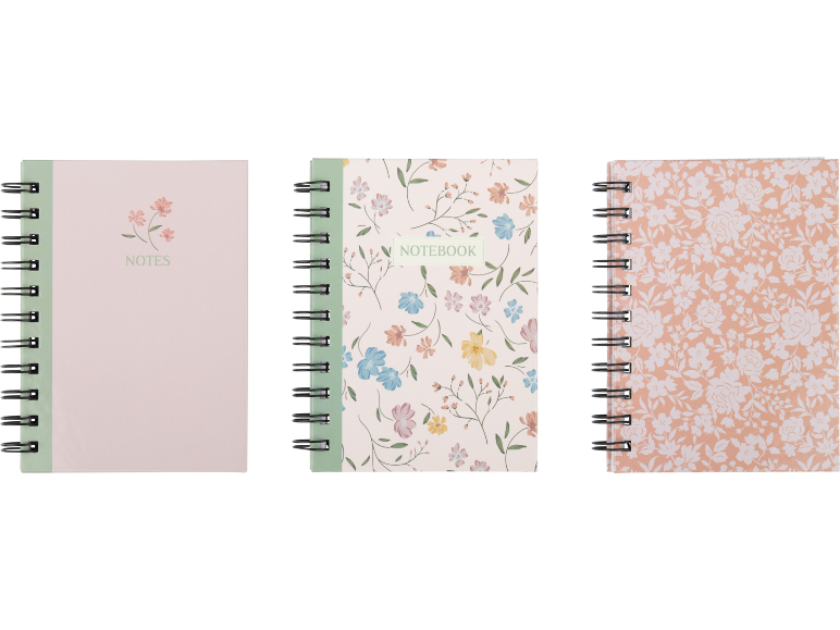 Três cadernos de espiral com padrões florais e as palavras «NOTES» e «NOTEBOOK».