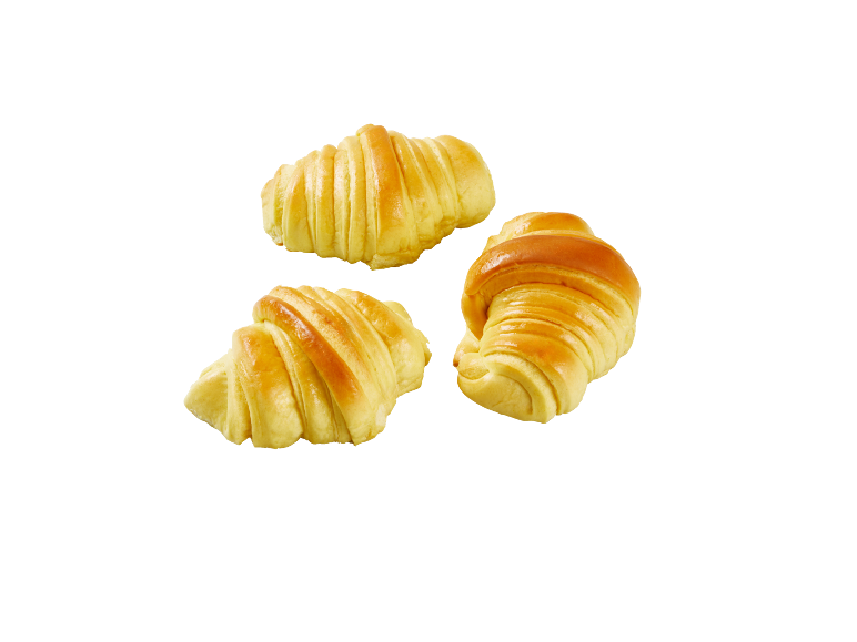 Três croissants dourados e brilhantes sobre um fundo preto.