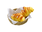 Dois croissants dourados numa cesta de vime com um guardanapo branco.