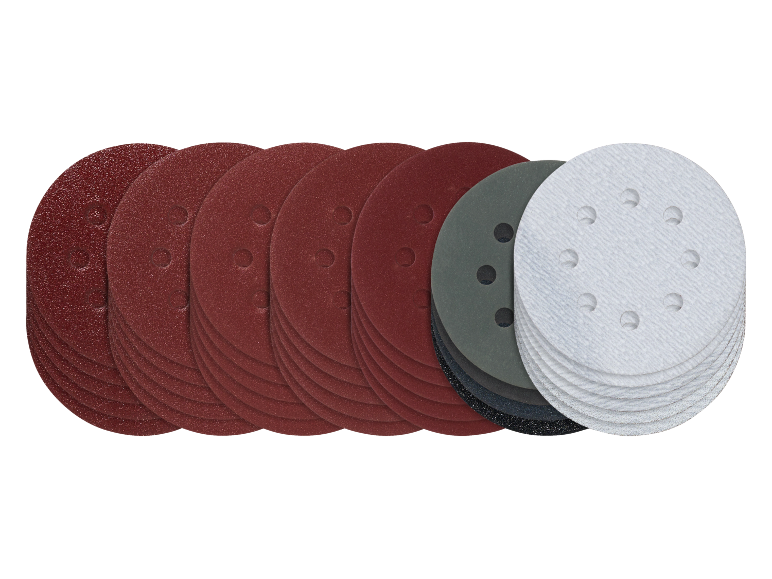 Pilha de discos de lixa em vermelho, cinzento e branco, com várias granulações e furos.