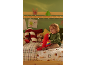 Criança a brincar com peluches numa cama com tema de Natal.