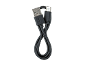Cabo de carregamento preto USB-A para USB-C, enrolado ordenadamente sobre fundo preto.
