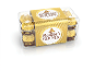 Caixa transparente com seis chocolates embrulhados em ouro, com uma etiqueta dourada ao centro.