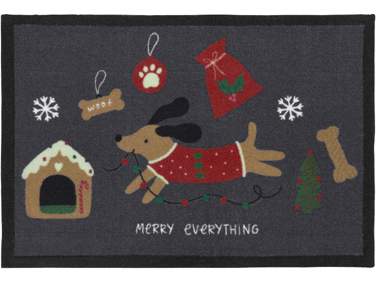 Capacho de Natal com um cão, casa de gengibre e decorações, com o texto 'MERRY EVERYTHING'.