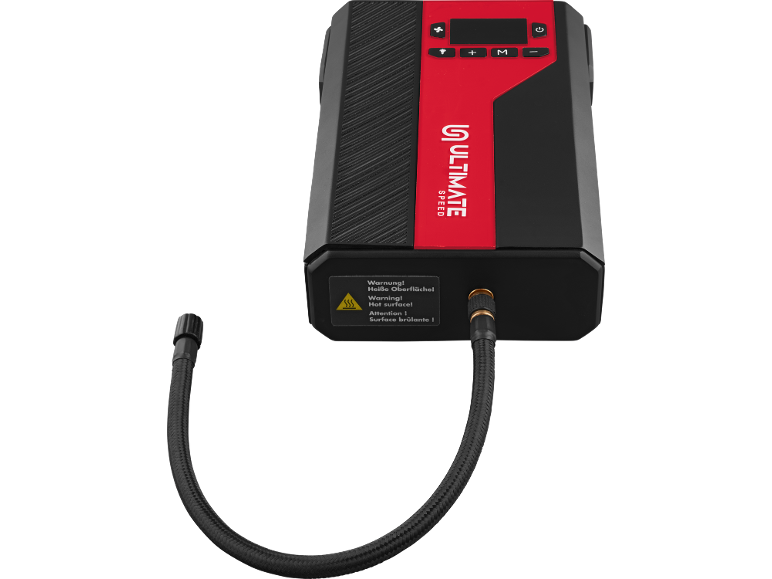 Compressor portátil preto e vermelho com ecrã digital e aviso de superfície quente.
