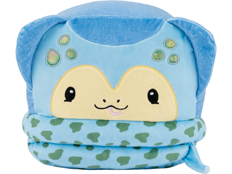 Peluche azul de tartaruga com rosto, olhos pretos e língua rosa.