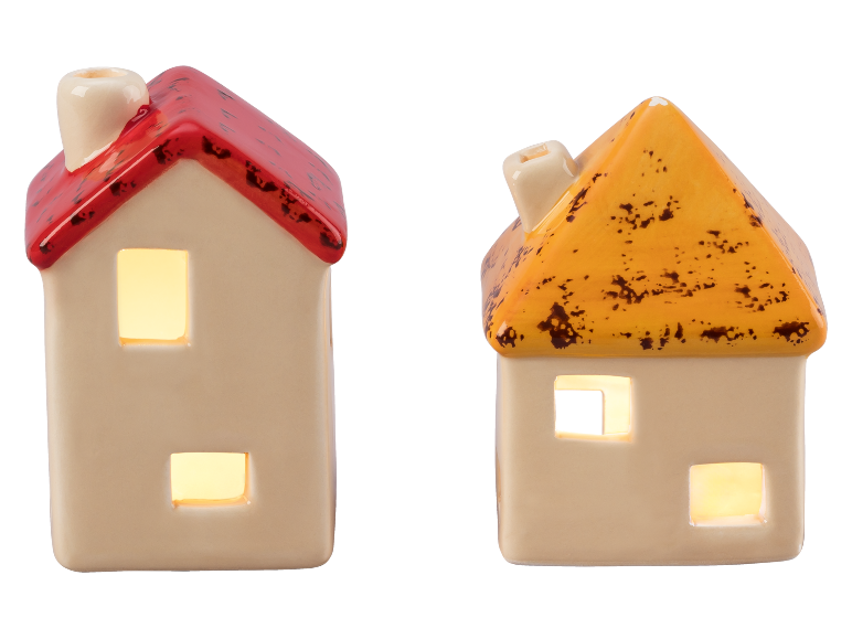 Duas casas de cerâmica com telhados vermelhos e laranjas, iluminadas por dentro.
