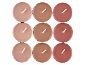 Nove velas tealight em tons variados de castanho e vermelho, dispostas em grade.