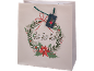 Saco de presente de Natal com uma coroa festiva, poinsétias e o texto 'ho ho ho'.