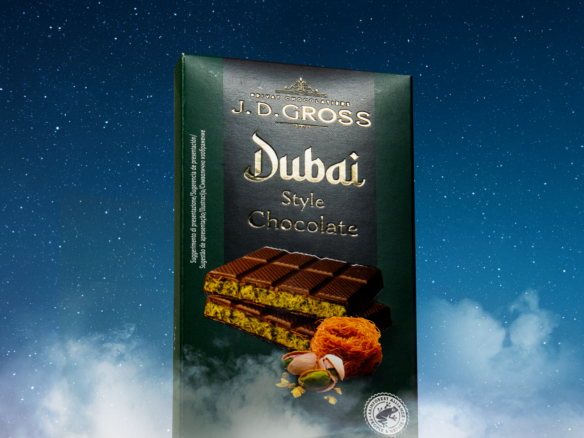 Chocolate J.D. Gross Dubai Style, com pistaches e fios de açúcar, em embalagem verde escura.
