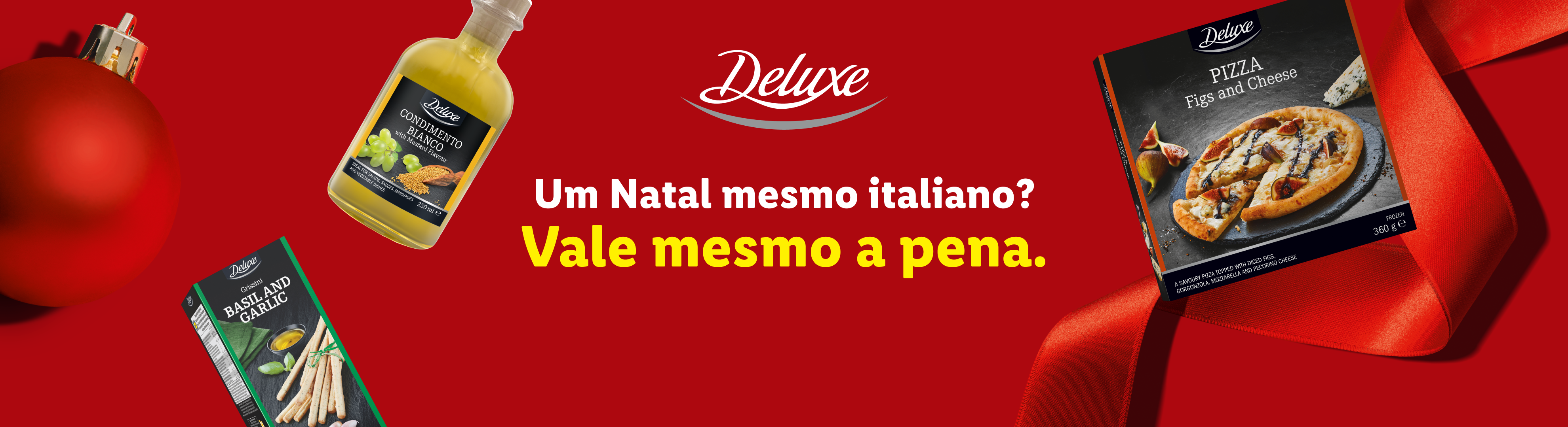Produtos Deluxe para um Natal italiano: pizza de figos e queijo, condimento branco e grissini de manjericão e alho.