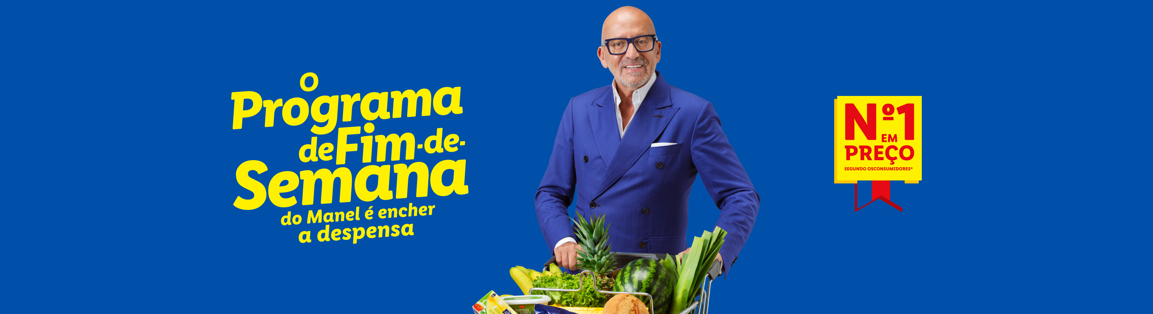 Homem sorridente com carrinho de compras cheio de frutas e legumes, com texto 'O Programa de Fim-de-Semana do Manel é encher a despensa' e 'Nº1 em Preço'.