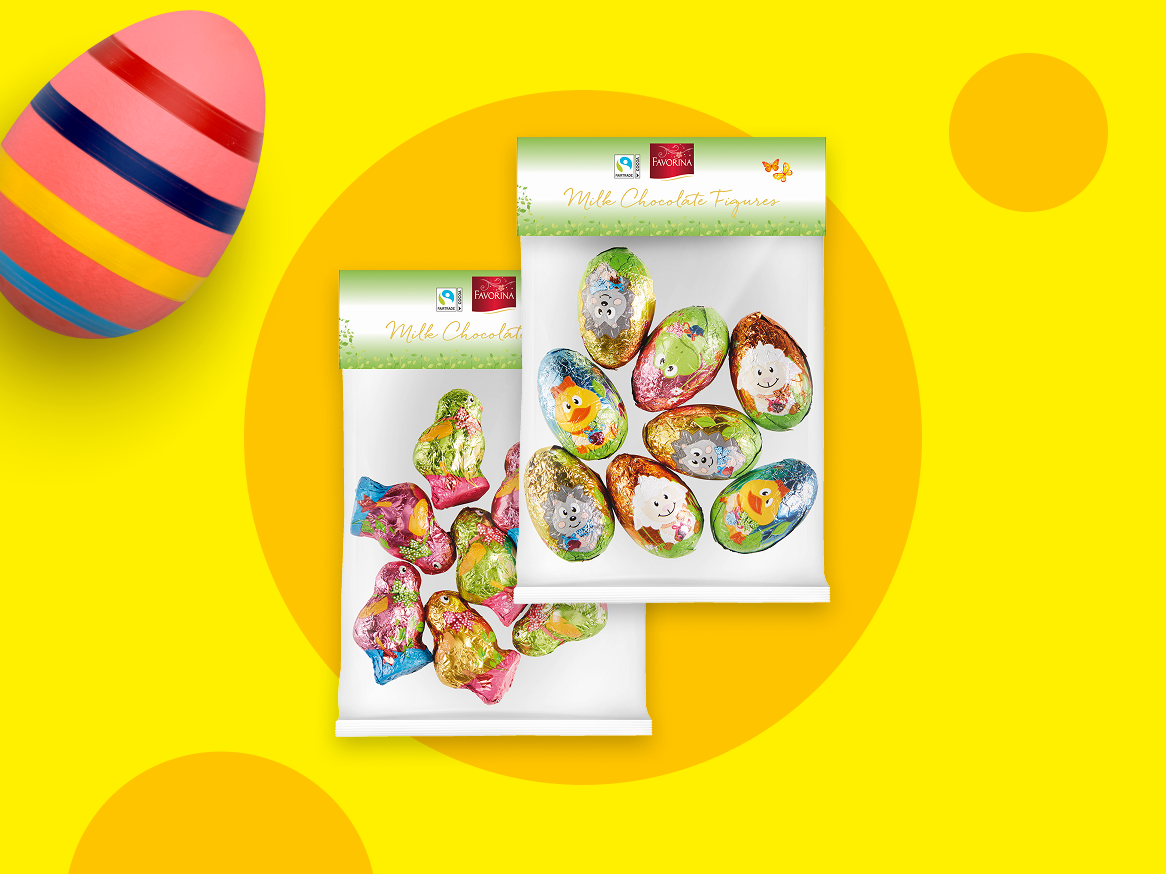 Dois sacos de figuras de chocolate de leite, um com ovos e outro com pássaros, e um ovo de Páscoa.