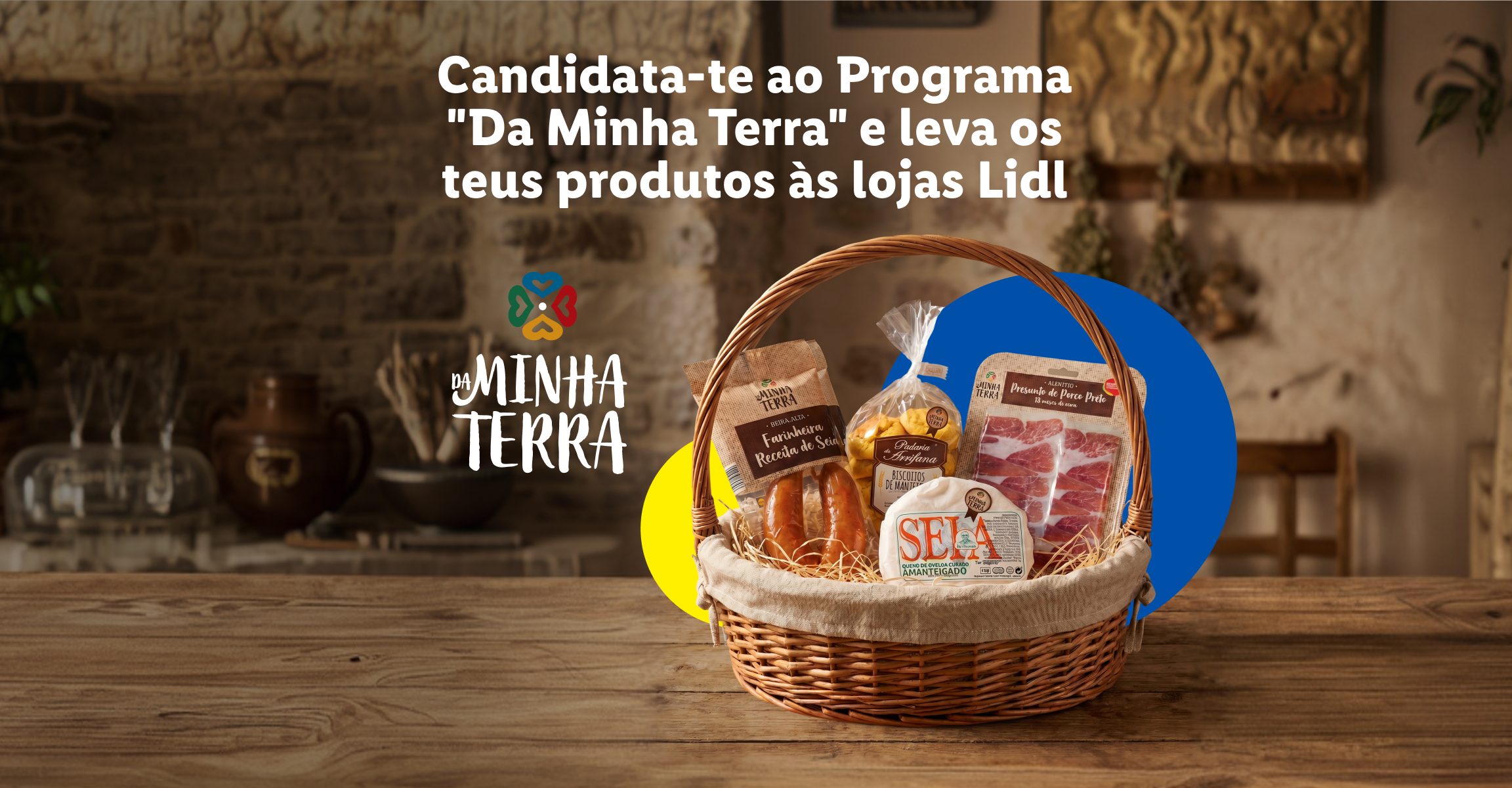 Cesto com produtos regionais como farinheira, presunto e queijo, com o texto 'Candidata-te ao Programa Da Minha Terra e leva os teus produtos às lojas Lidl'.