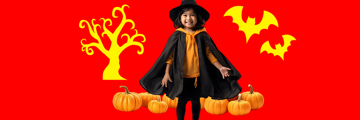 Criança em traje de Halloween, abóboras e morcegos.