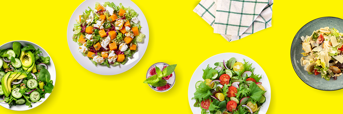 Saladas com abóbora, abacate e Caesar.